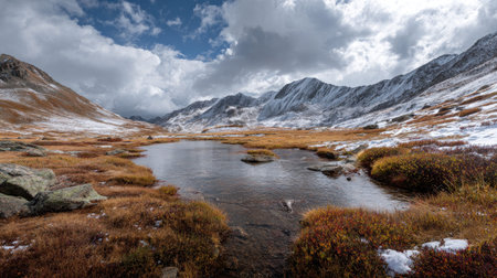 A photograph of Alpine mountains 452 with alpine lake basin, alpine tundra plants, snowy alpine...