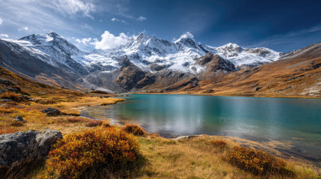 A photograph of Alpine mountains 247 with snow capped alpine peaks, glacial lake water, golden...