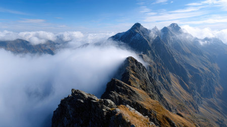A photograph of Alpine mountains 439 with alpine ridge above clouds, rocky mountain outcrops, golden...