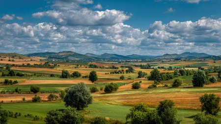 A photograph of Central European countryside with agricultural landscape with patchwork fields,...