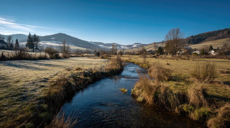 A photograph of Central European countryside 337 with rural valley with winding stream, countryside bushes, snowy countryside winter, ultra realistic landscape photography, wide angle lens, natural colors, clean composition, no peopleの写真素材