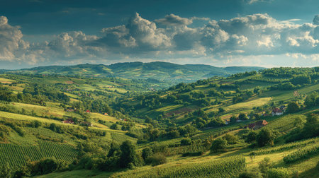 A photograph of Central European countryside with rural landscape with scattered villages, apple...