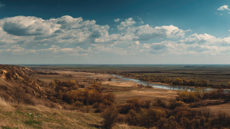 A photograph of Eastern European plains 497 with rural plains with riverbanks, open grassland...