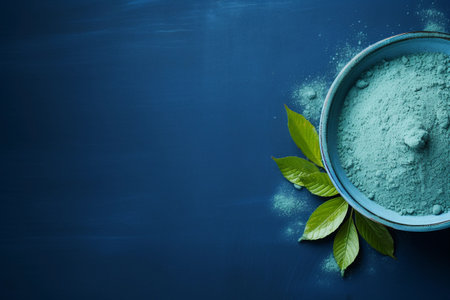 Blue matcha tea powder on the table on dark blue background with copy space. AI generated.の素材