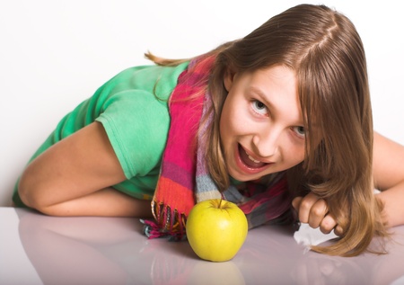 Teen attacks an apple like a tiger の写真素材