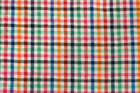 Plaid fabric texture background. Red, green and yellow checkered pattern.の写真素材