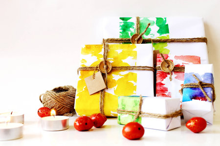 gift box wrapping and candle on white backgroundの写真素材
