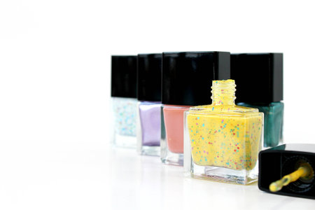 nail polish in glass bottle black lid have copy space on white backgroundの写真素材