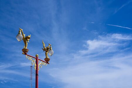 Blue sky background and Kinnaree golden lamp in the left sideの写真素材
