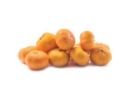 The pile of fresh oranges isolated on white backgroundの写真素材