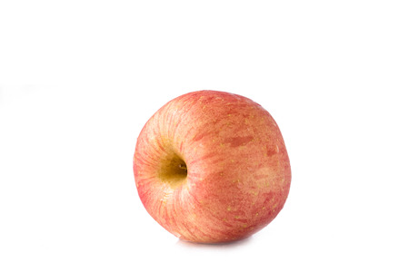 The "FUJI" apple isolated on white background.After clean it's with waterの写真素材