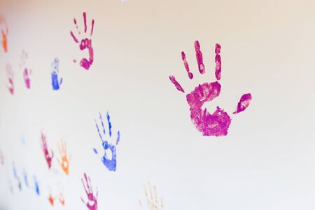 imprint of a child's hand on the wall. concept of friendship and the background in a children's gym.の写真素材