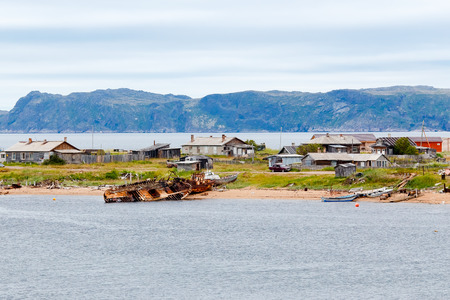 Teriberka, Kola Peninsula, Shore with parked fishermen's ships, some of the corpses sank.の写真素材