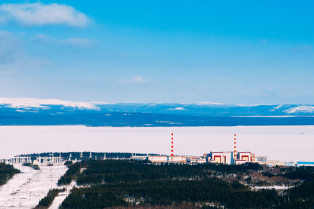 Kola NPP  nuclear power station from the mountain. Industrial landscape. In the background are the mountains of Khibiny and Imandra lake.の写真素材