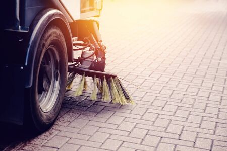 Close-up street sweeper machine cleaning the streets. Concept clean streets from debris.の写真素材