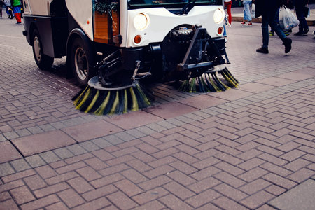 Close-up street sweeper machine cleaning the streets. Concept clean streets from debris.の写真素材