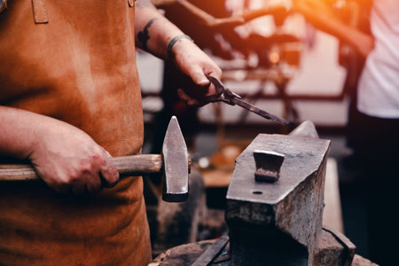 Blacksmiths work as forging forging on metal. The concept of making products from iron.
