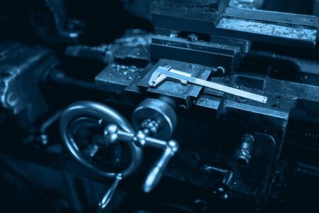 Milling machine, lathe and measuring ruler. Concept industrial photo of machine parts and devices.の写真素材