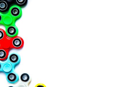 Fidget finger spinner, anxiety relief toy on white isolated background, copyspace. Concept relieving stressの写真素材