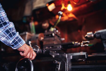 master man in years manages the milling machine, the concept of industrial photography, the 60th year, factories for parts, home workshops in the garage.の写真素材