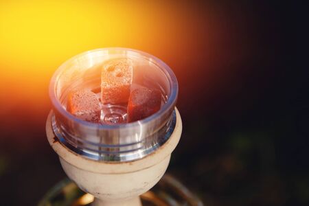 shisha hookah red hot coals. Sparks from breathe. Concept leisure in natureの写真素材