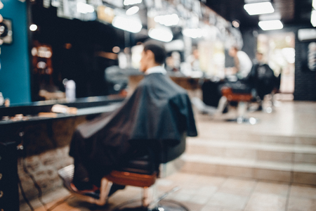 Blurred abstract background of modern hairdresser and hair salon, barber shop for men.の写真素材