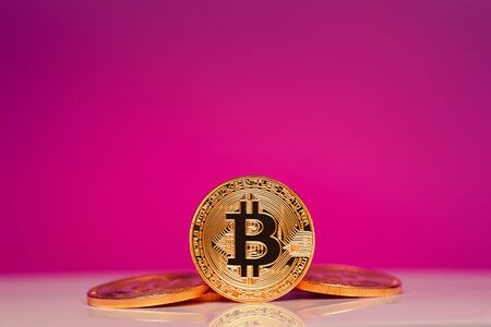 Gold Bitcoin on the pink background. Concept miningの写真素材