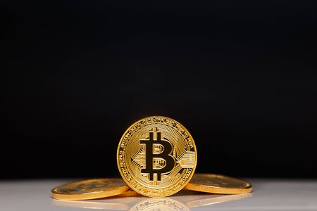 Gold Bitcoin on the black background. Concept miningの写真素材