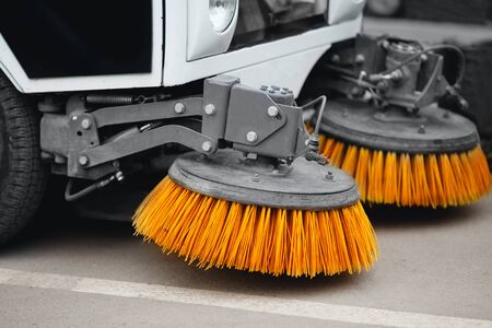 Close-up street sweeper machine cleaning the streets. Concept clean streets from debris.の写真素材