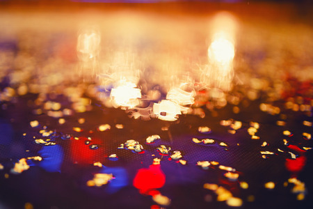 blurred background with yellow leaves, drops of water, bokeh.の写真素材