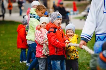 TOMSK, RUSSIA - September 10, 2017: day of Tomsk, children pull a rope, laugh, have fun, smile.のeditorial素材