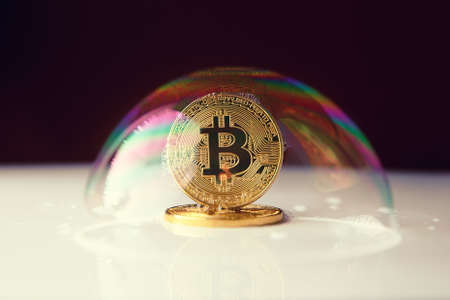 bitcoin. bitcoin in a soap bubble on black backgroundの写真素材