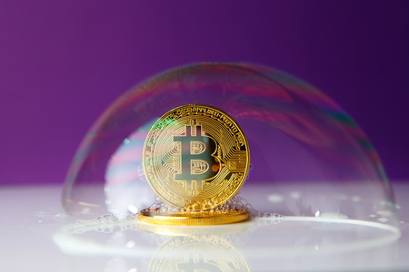 bitcoin. bitcoin in a soap bubble on purple backgroundの写真素材