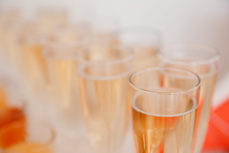 A number of glasses of champagne. Alcohol sparkles with bubbles in wine glasses
