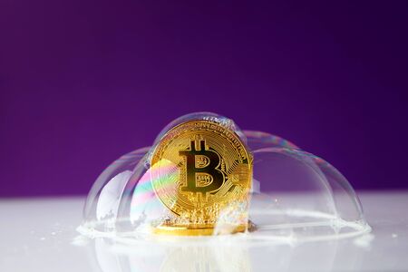 bitcoin. bitcoin in a soap bubble on purple backgroundの写真素材