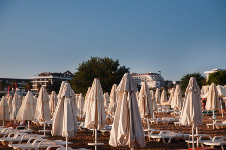 Beach loungers and umbrella on sunset, nobodyの写真素材