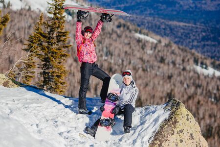 Sheregesh, Kemerovo region, Russia - April 16, 2016: Group of Snowboarder in the background of mountains and blue skyのeditorial素材
