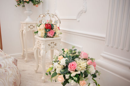Artificial flowers. Vase with a flower arrangement in an expensive interior.の写真素材