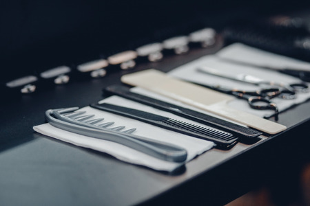 hairdresser's tools: combs, razors, scissors, clip-on hair clipperの写真素材