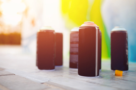 Close-up of cylinders with paint stand in a row. concept of graffitiの写真素材