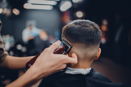 Barber shop. Barbershop Hairdresser makes hairstyle manの写真素材
