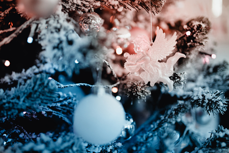 New Year's Toys xmas. Decorated Christmas tree on blurred, bokeh backgroundの写真素材