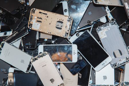 TOMSK, RUSSIA - November 29, 2017: broken panels and screens of iPhone phones lie in the service and are preparing for recycling and disposalのeditorial素材