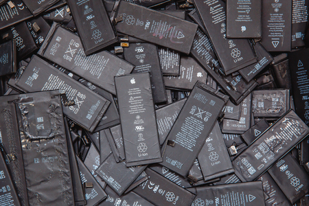 TOMSK, RUSSIA - November 29, 2017: Used batteries of mobile phones iPhone, preparation for recycling and disposal in the serviceのeditorial素材