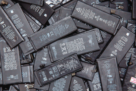 TOMSK, RUSSIA - November 29, 2017: Used batteries of mobile phones iPhone, preparation for recycling and disposal in the serviceのeditorial素材