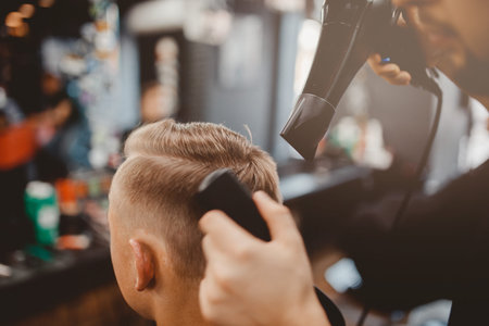 Barbershop. Close-up of a man's haircut, master Barber Shop does the hair stylingの写真素材