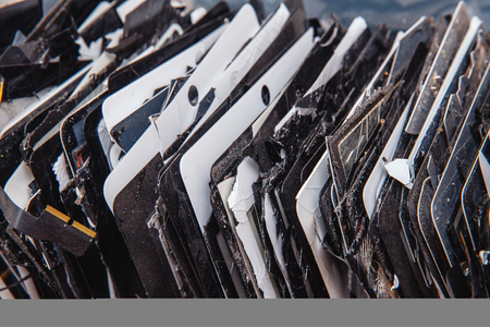 TOMSK, RUSSIA - November 29, 2017: broken panels and screens of iPhone apple phones, table lie in service and are preparing for recycling and disposalのeditorial素材