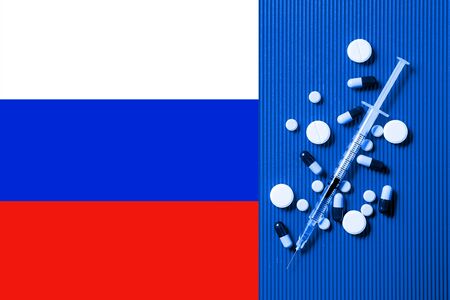 Medical syringe with doping against the background of the flag of Russia. Concept of doping in sportの写真素材