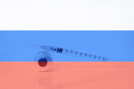 Medical syringe with doping against the background of the flag of Russia. Concept of doping in sportの写真素材