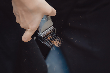 Salon hair. Hairdresser cuts torn hair endsの写真素材